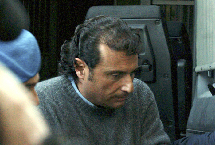 Capt. Francesco Schettino, the captain of the cruise ship that ran aground on Friday, leaves court in Grosseto, Italy, today. Prosecutors have accused Schettino of manslaughter, causing a shipwreck and abandoning his ship before all passengers were evacuated.