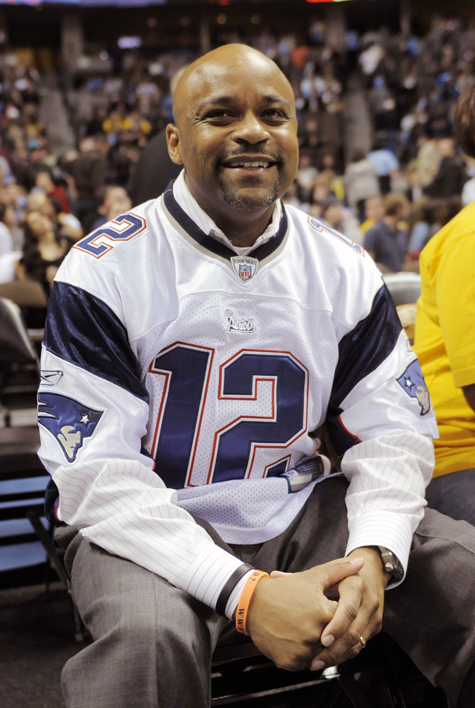 Denver Mayor Michael Hancock wears a Patriots jersey to pay off a bet with the Boston mayor during the second quarter of an NBA basketball game between the Denver Nuggets and the Utah Jazz on Sunday.