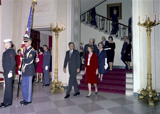 This Nov. 20, 1963, photo released by the John F. Kennedy Presidential Library and Museum in Boston, shows President John F. Kennedy, First Lady Jacqueline Kennedy, Chief Justice Earl Warren, Mrs. Warren, and others descending the Grand Staircase during the Judicial Reception at the White House.