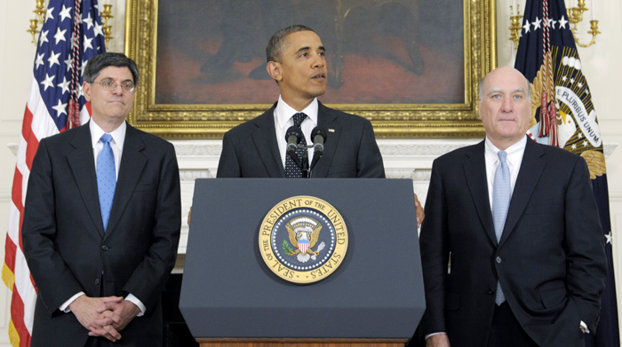 President Barack Obama is flanked today by outgoing White House Chief of Staff William Daley, right, and his replacement, current Budget Director Jack Lew.