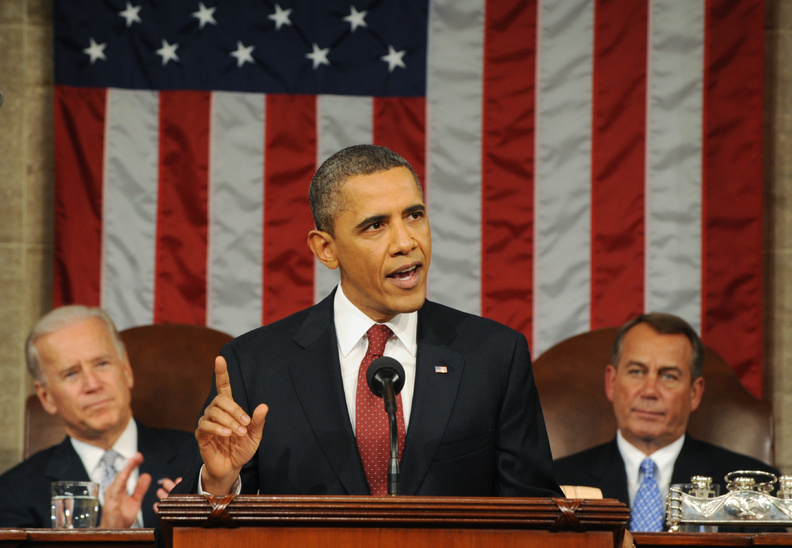 President Barack Obama delivers his State of the Union address on Capitol Hill in Washington tonight. Listening in back are Vice President Joe Biden and House Speaker John Boehner, right. HORIZONTAL
