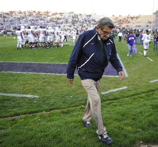 In this Oct. 22, 2011, photo, Penn State coach Joe Paterno walks off the field after warmups before a game against Northwestern in Evanston, Ill.