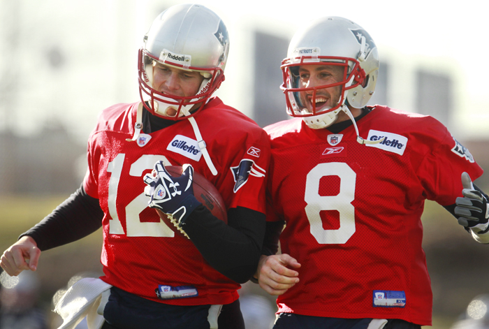 New England Patriots quarterbacks Tom Brady, left, and Brian Hoyer, right, perform field drills during a team practice in Foxborough, Mass., on Wednesday. The Patriots are scheduled to play the Denver Broncos in an AFC divisional playoff game Saturday, Jan. 14 in Foxborough.