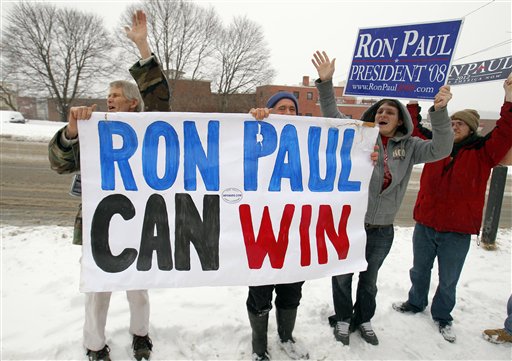 Supporters cheer as Ron Paul leaves a campaign stop in Bangor today.