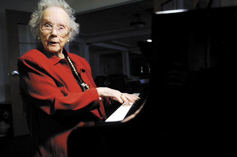 FOREVER YOUNG: Beatrice Robbins, 102, plays the piano after the birthday party held in her honor Saturday in the lobby of her home at Granite Hill Estates in Hallowell. Robbins, who turned 102 on Monday, said her hearing is slightly diminished but she still loves the sound of music.