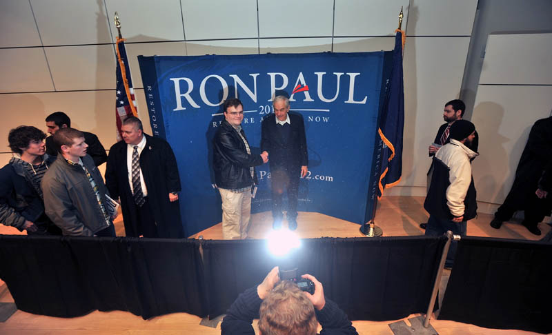 Staff photo by Michael G. Seamans Republican Party presidential hopeful, Ron Paul, greets supporters following a speech at the Ostrove Auditorium at Colby College on Friday.