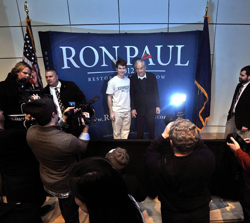 PAUL FAN: Colby College senior James Geoghegan poses for a picture with Ron Paul at Ostrove Auditorium at Colby College after a campaign speech on Friday.