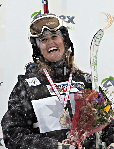 In this March 17, 2006, photo, Sarah Burke celebrates her gold medal in the halfpipe FIS World Cup event in Penticton, British Columbia.