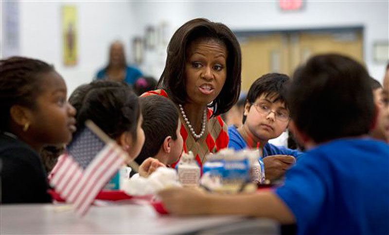 First lady Michelle Obama has lunch with school children at Parklawn elementary school in Alexandria, Va. on Wednesday, Jan. 25, 2012. (AP Photo/Pablo Martinez Monsivais)