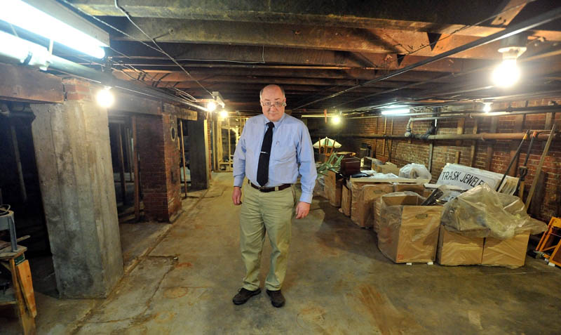 MESS: John Anderson, owner of Trask Jewelers Inc. in Farmington, stands in the basement of his store that was filled with water from a recent water main break.
