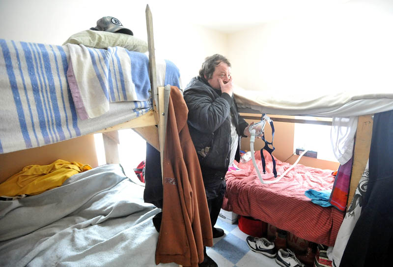 HOME: Brent Tweedie, 47, shows his bed at the Trinity Men's Homeless Shelter in Skowhegan Saturday morning. Tweedie has been a resident since July 2011.
