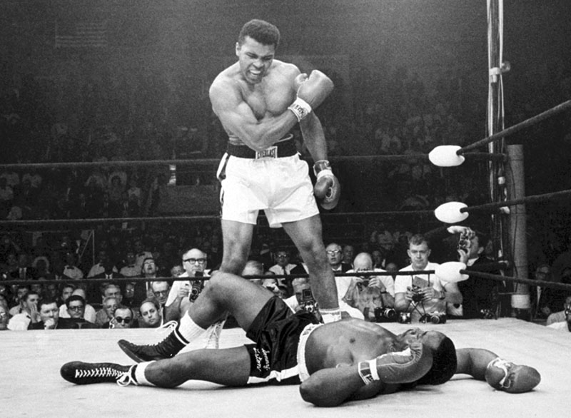 BIG MOMENT: Heavyweight champion Muhammad Ali stands over fallen challenger Sonny Liston, after dropping Liston with a short hard right to the jaw in Lewiston on May 25, 1965. Ali turns 70 on Tuesday.