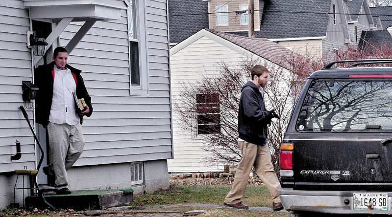 RETURN MY DAUGHTER: Justin DiPietro, right, leaves his mother's home at 29 Violette Ave. in Waterville on Monday followed by his brother Lance DiPietro. Justin Dipietro pleaded for the person who took his daughter Ayla Reynolds on Dec. 17 to return her to him.
