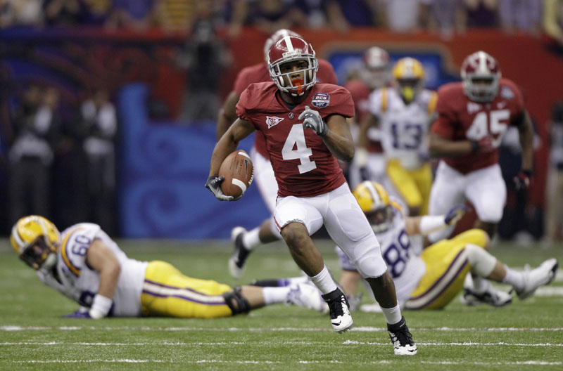 BUSTING LOOSE: Alabama's Marquis Maze returns a punt 49 yards during the first half of the BCS national championship game against LSU on Monday night in New Orleans. While the return led to a field goal and the game's first points, Maze soon left with an apparent hamstring injury.