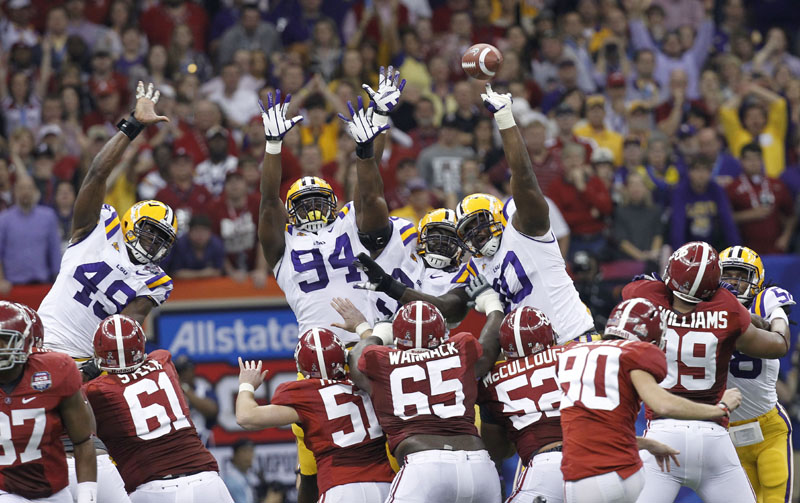STUFFED: LSU defensive tackle Michael Brockers (90) blocks an Alabama field goal attempt during the first half of the BCS national championship game Monday night in New Orleans.