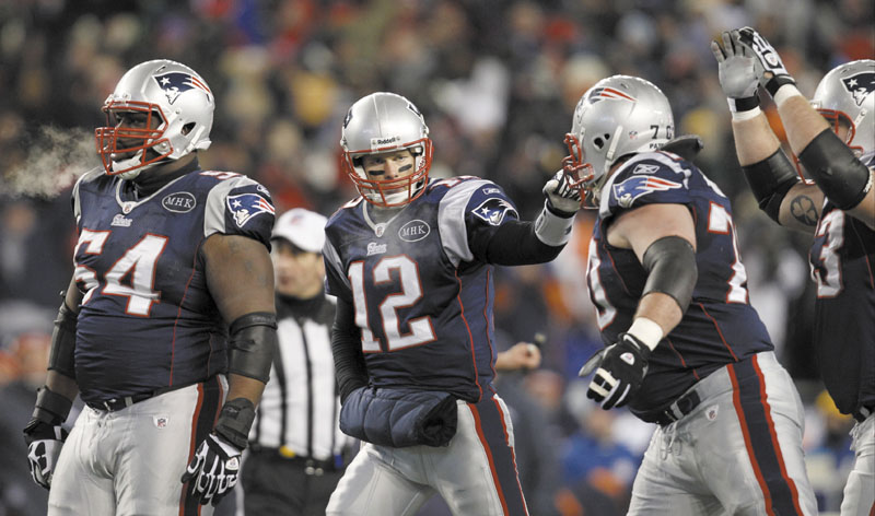 TOUGH TASK: New England Patriots offensive lineman Brian Waters, left, and Logan Mankins, right, are part ofa a group that will try to give quarterback Tom Brady, center, time to pass against a strong New York Giants defense in Super Bowl XLVI. playoff playoffs