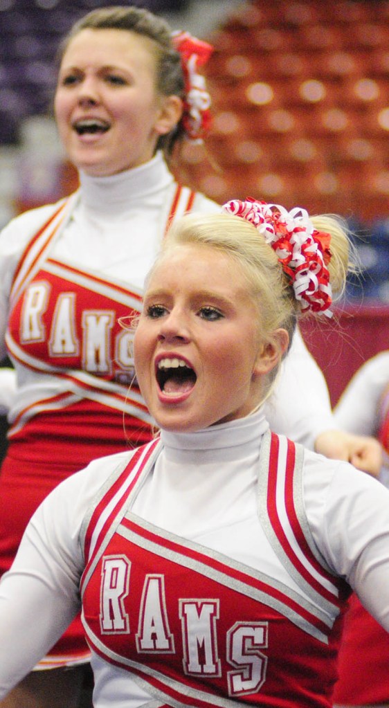 HERE WE GO: Cony High School’s Leah Howard-Berry, top, and Alyssa Brochu yell out a cheer during the Eastern Maine Class A cheerleading competition Saturday night at the Augusta Civic Center.