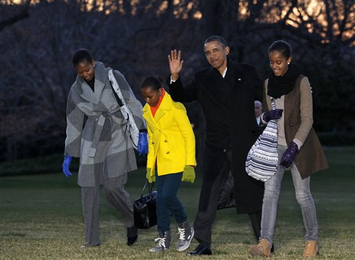 President Barack Obama, first lady Michelle Obama and their daughters Sasha and Malia arrive on the South Lawn of the White House, Tuesday, Jan. 3, 2012, in Washington. The first family was returning from their family vacation to Hawaii. (AP Photo/Haraz N. Ghanbari) President Barack Obama, first lady Michelle Obama and their daughters Sasha and Malia arrive on the South Lawn of the White House, Tuesday, Jan. 3, 2012, in Washington. The first family was returning from their family vacation to Hawaii. (AP Photo/Haraz N. Ghanbari)