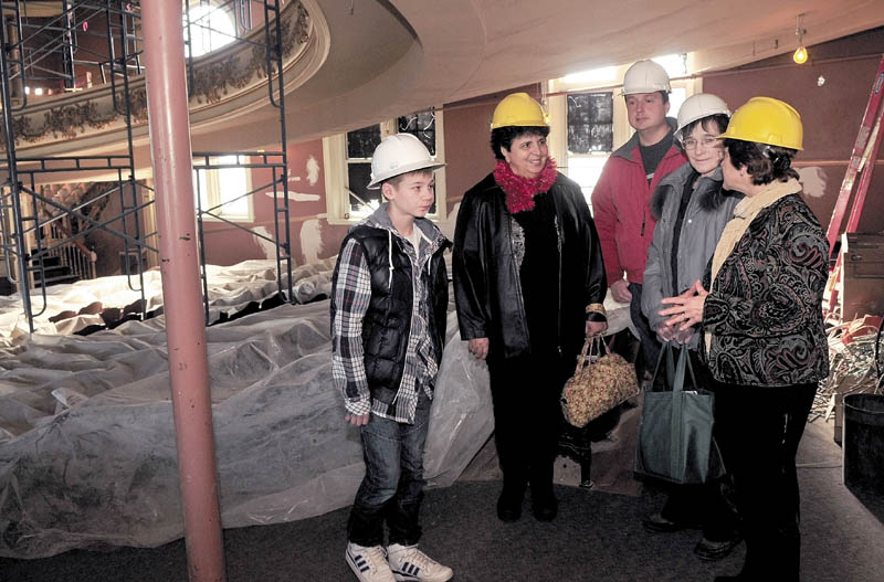 SISTER CITY: Anton Yeltsov, left, and Arina Pavlova, second from right, of Kotlas, Russia, listen to Barbara Allen, right, speak about renovations to the Waterville Opera House during a tour of city hall recently. Kotlas and Waterville are sister cities. Waterville hosts Martha Patterson and Mark Fisher led the tour.