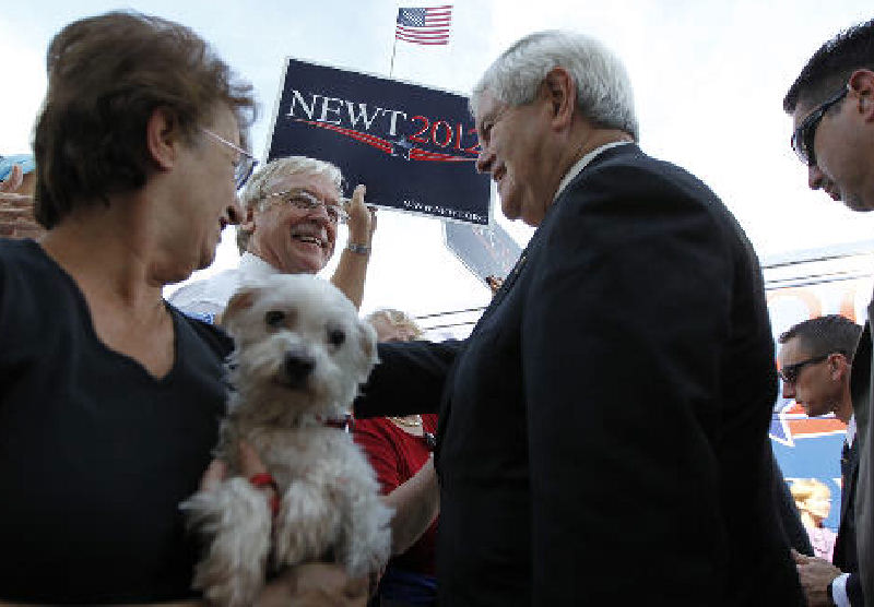 Republican presidential candidate Newt Gingrich campaigns at The PGA Center for Golf Learning and Performance, Saturday, in Port St. Lucie, Fla.