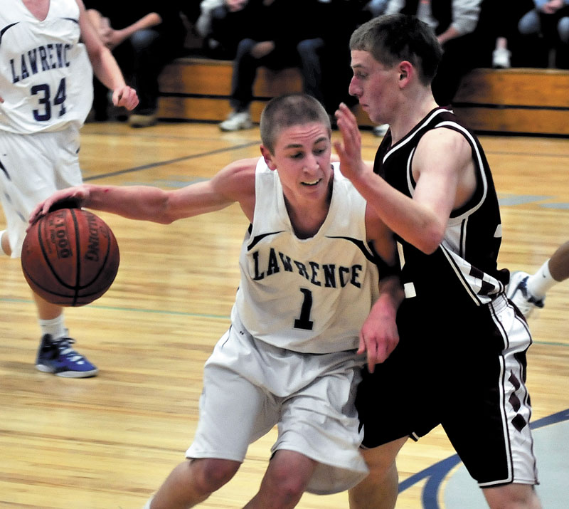 ON THE MOVE: Lawrence’s Emmitt Faulkner tries to drive past Bangor’s John Szewczyk during the Bulldogs’ 45-41 win Tuesday in Fairfield.