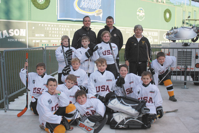 HERE WE ARE: The Maranacook Mites recently played at Fenway Park. Front from the left: Jacob Godbout, Chase Cloutier, Thomas Thornton (goalie). Second from from the left: Gavin Saucier, Wyatt Lyons, Jack Bonnefond, Adrian O'Connell, Carson Palmer. Back row of players: Thomas Clauson, Sam Linton, Savannah Mitchell, Nathan Miller. Coaches from the left: Head coach Mike Saucier, Steve Godbout, Gus Cloutier.