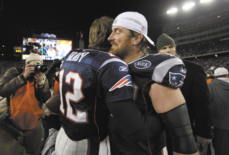 WE GOT YOUR BACK: Tackle Matt Light, right, is part of the New England Patriots’ offensive line, which is responsible for keeping defenders away from quarterback Tom Brady (12). The Patriots’ offensive line has been shuffled all season because of injuries. playoff playoffs