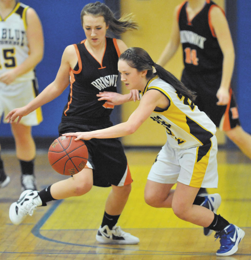 ON THE MOVE: Mt. Blue High School’s Amy Hilton, right, recovers the ball as Brunswick High School’s Lauren Carlton plays defense in the first quarter Friday at Mt. Blue Junior High School in Farmington.