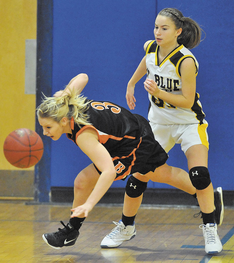 GET AFTER IT: Brunswick High School’s Erica French, left, dives for a loose ball as Mt. Blue High School’s Mackenzie Conlogue watches in the second quarter Friday at Mt. Blue Junior High School.