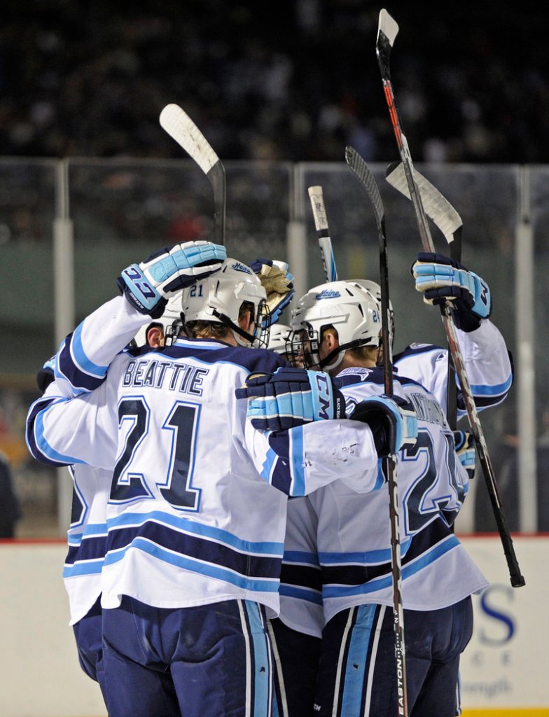 UMaine celebrates a first-period goal by Mark Anthoine, who got an assist from Kyle Beattie.