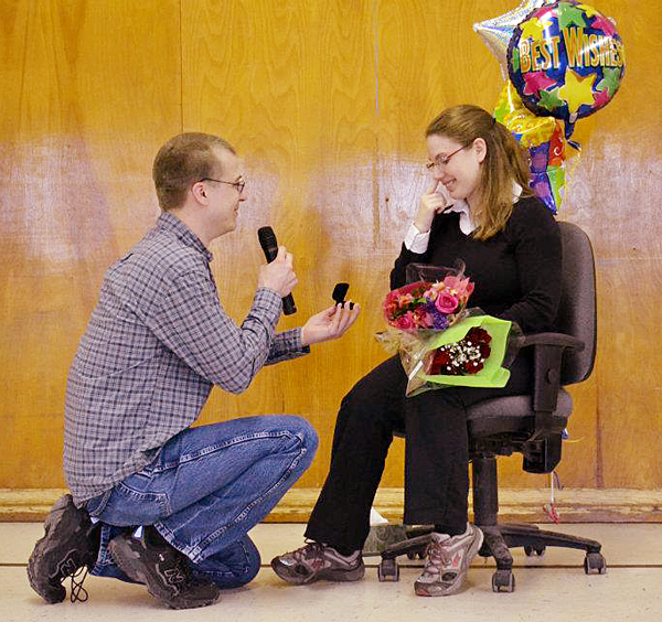 Bill Hensley proposes to Rebecca Lussier during a student assembly at Martel Elementary School in Lewiston on Monday afternoon. But her boyfriend, Bill Hensley