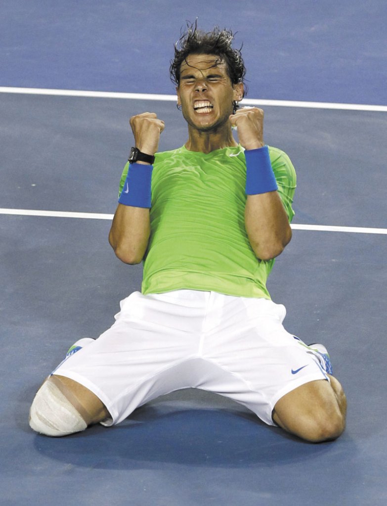 BACK IN THE FINALS: Rafael Nadal celebrates his 6-7 (5), 6-2, 7-6 (5), 6-4 victory against Roger Federer during the semifinals of the Australian Open on Thursday in Melbourne. With that, Nadal beat Federer for the eighth time in their 10 Grand Slam matchups.