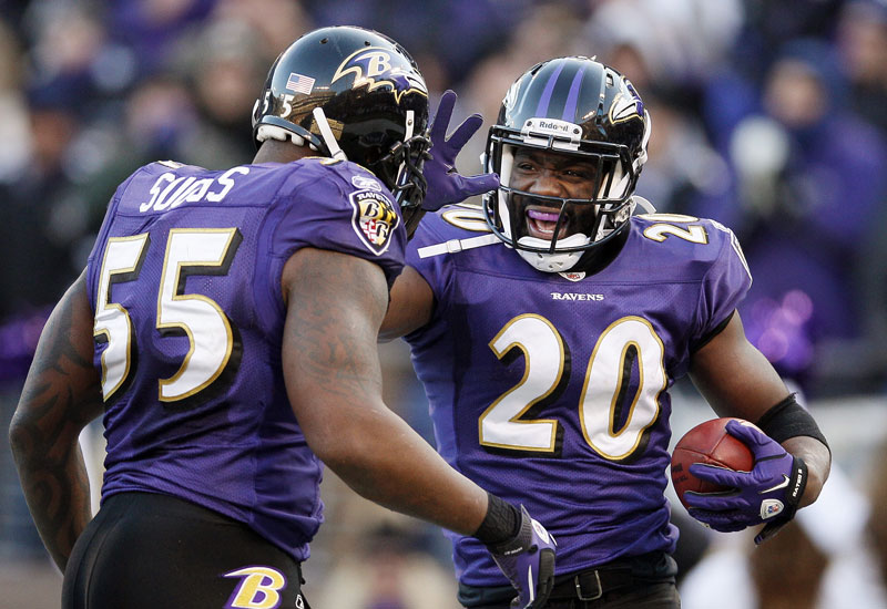 ALL RIGHT: Baltimore Ravens free safety Ed Reed, right, celebrates his interception with teammate Terrell Suggs during the Raven’s 20-13 win over the Houston Texas on Sunday in Baltimore. The Ravens will face the Patriots in the AFC Championship Game.