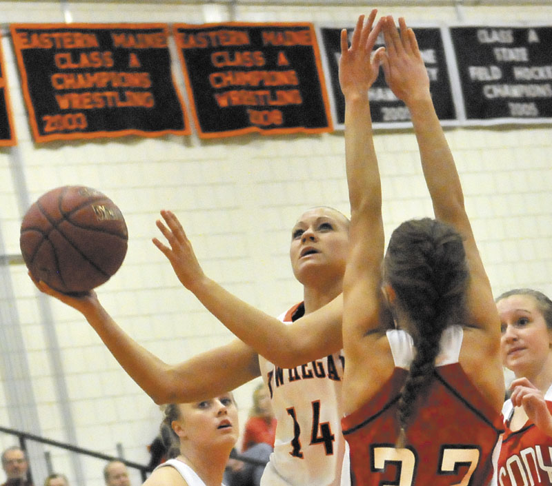 PRESSURE DEFENSE: Skowhegan Area High School’s Amanda Johnson drives to the hoop as Cony High School’s Josie Lee tries to defend her in the first half of the Indians’ 49-36 loss Friday in Skowhegan.