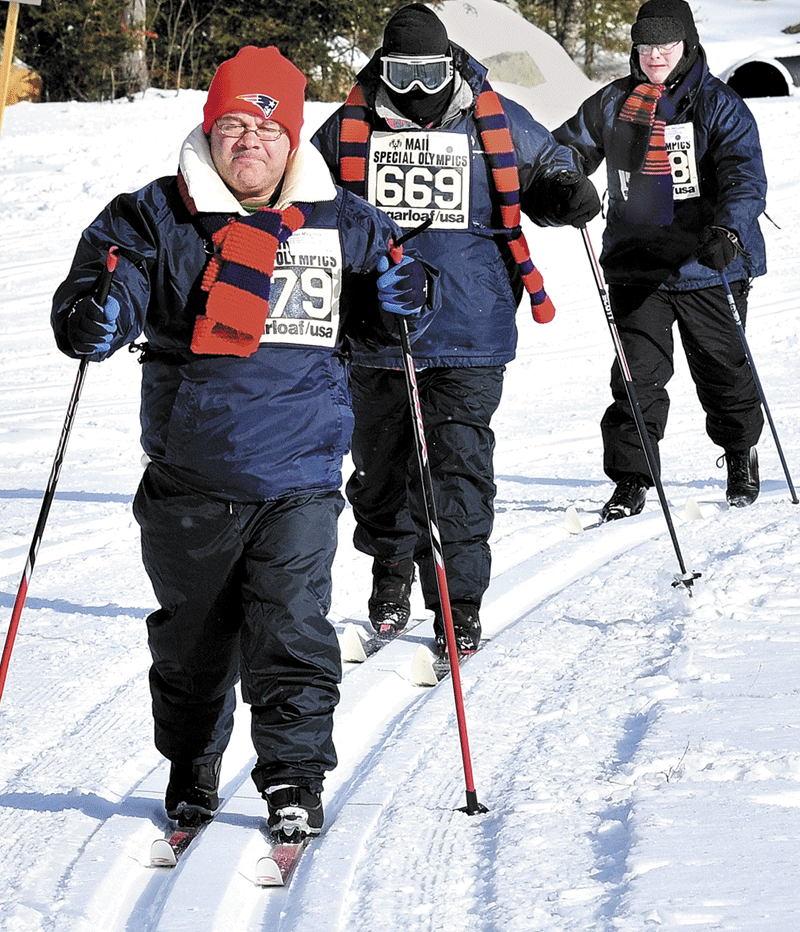 LEFT: Nordic skiers from Somerset Team Outreach compete in the 500 meter race. Leading is Peter Maginnis, followed by John Domereki and Jim Lynds.
