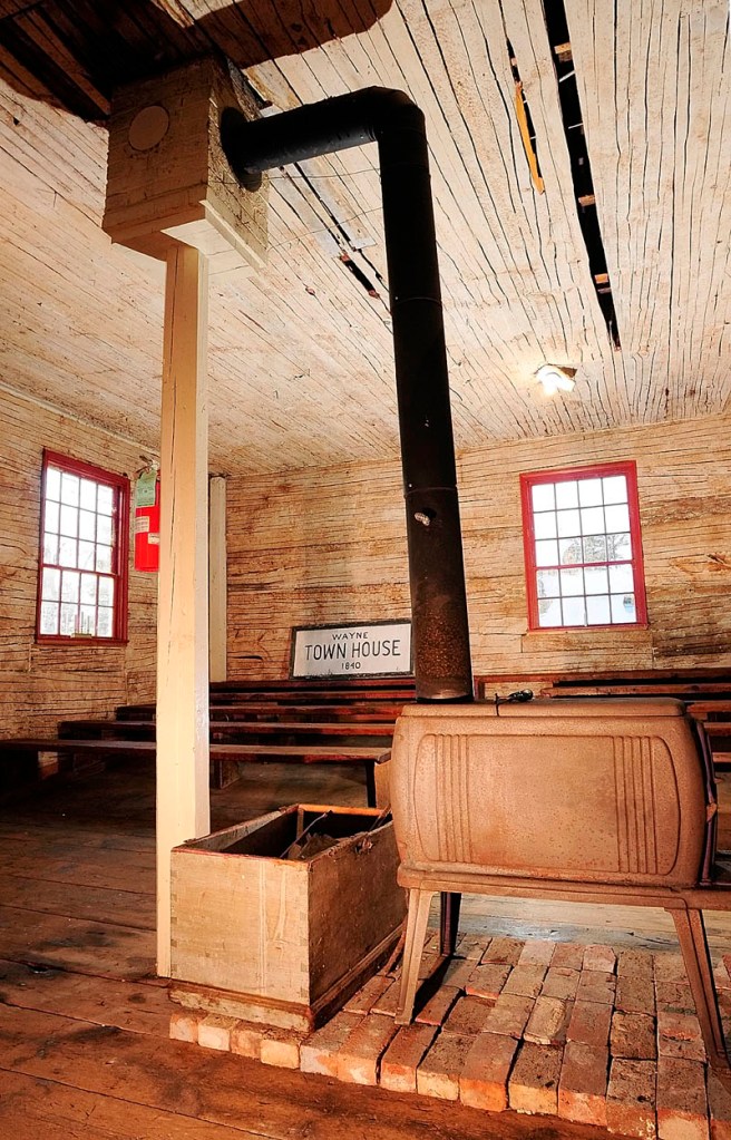 A wooden post supports the brick chimney in the Wayne Town House. The historic building is located on Route 133 across the road from the state boat launch. The lathes are visible because the horse hair plaster was removed during the recent renovations.
