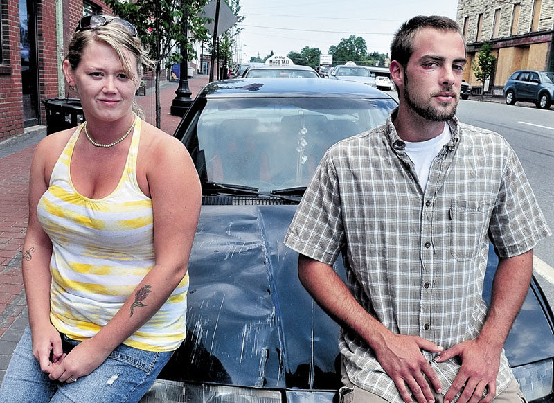 NOT THIS YEAR: Christina Tirrell and Lucas Drinkwater are shown last July beside Tirrell’s vehicle, which she says was hit by a truck after the 2011 West Athens Fourth of July parade. Drinkwater said he was beaten and injured in a fight after the accident. This year's parade has been cancelled.