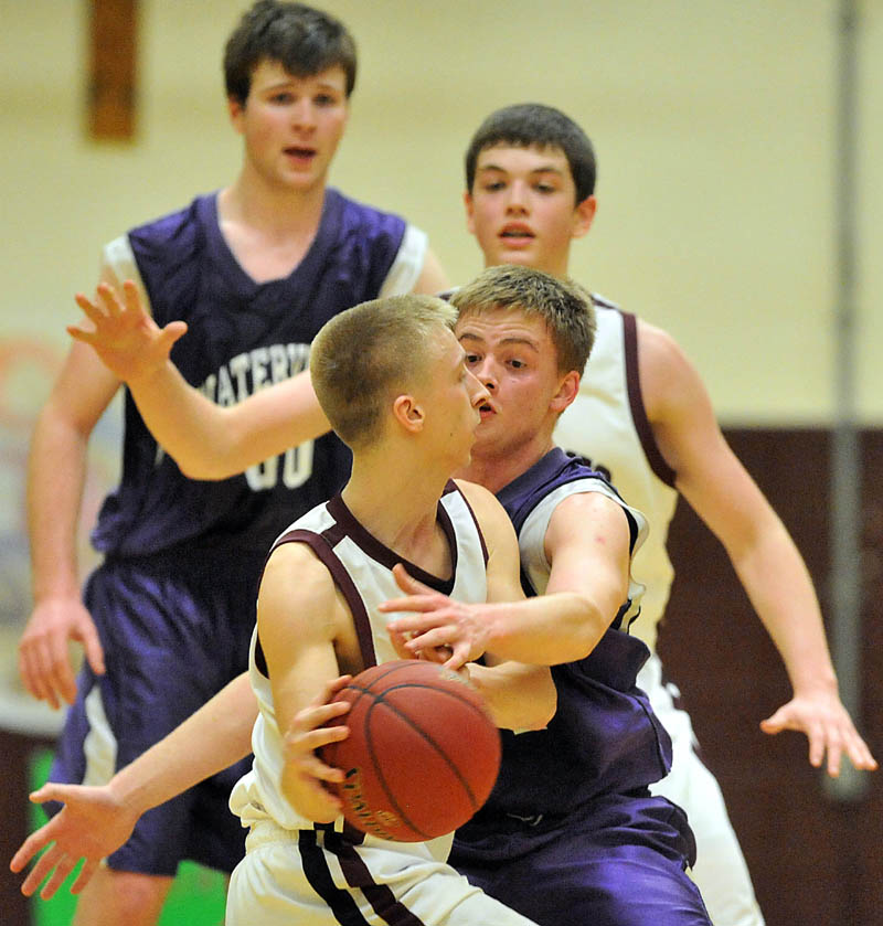 Photo by Michael G. Seamans Game action from Eastern Class B boys playoff game at Nokomis High School in Newport Wednesday night. Nokomis defeated Waterville 50-49 in overtime..