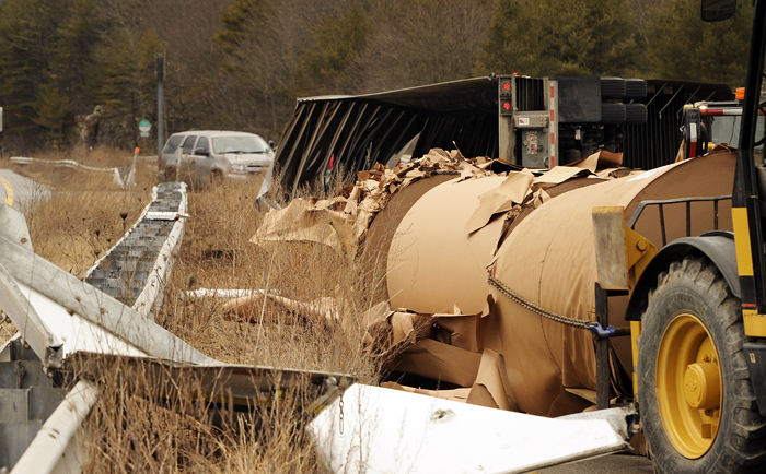 The tractor-trailer was traveling from New Brunswick, Canada, and carrying large rolls of paper.