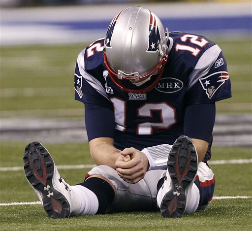 Patriots quarterback Tom Brady reacts after New York Giants linebacker Chase Blackburn intercepted Brady's pass intended for tight end Rob Gronkowski during the second half of the Super Bowl.