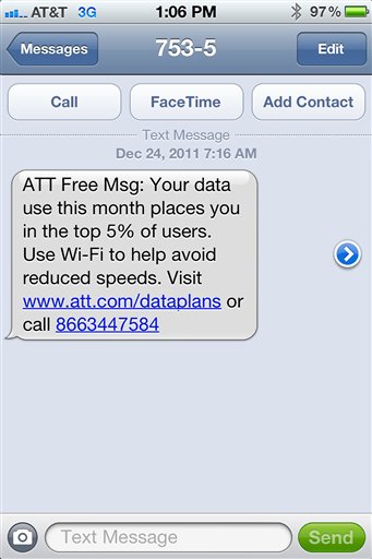 This undated screen grab provided by Mike Trang shows a warning message on the screen of Trang's iPhone that he received from AT&T advising he was in danger of having his data speeds throttled. AT&T considers Trang to be among the top 5 percent of the heaviest cellular data users in his area.