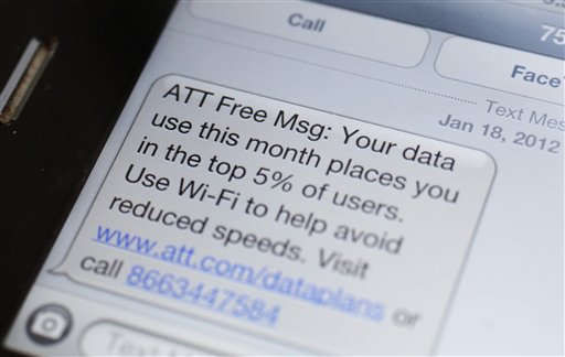 The screen on a smartphone showing a text message to an AT&T customer in New York.