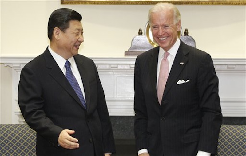 Vice President Joe Biden meets with Chinese Vice President Xi Jinping in the Roosevelt Room at the White House in Washington on Tuesday, Feb. 14, 2012. (AP Photo/Charles Dharapak)