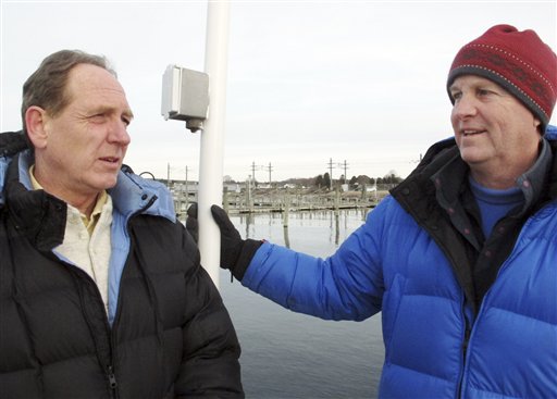 Craig Harger, left, and Charlie Buffum stand on a dock Wednesday in Stonington, Conn., before sailing into Block Island Sound where they have located a shipwreck thought to be the USS Revenge, commanded by Navy hero Oliver Hazard Perry.