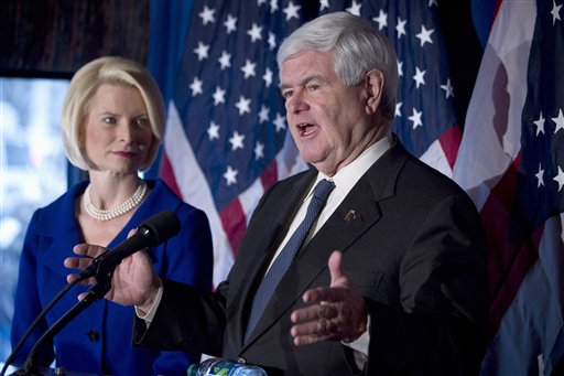 In this Feb. 7, 2012, photo, Republican presidential candidateNewt Gingrich, accompanied by his wife Callista, speaks in Cincinnati, Ohio. Presidential campaigns and outside political groups began filing detailed financial reports Monday, offering a behind-the-scenes glimpse into the identities of wealthy supporters who will help elect the next president and details on how tens of millions of campaign dollars have been spent.