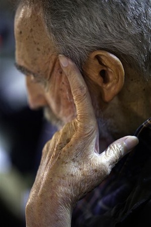 In this Feb. 3, 2012 photo released by the state media, Cuba's leader Fidel Castro listens during the presentation of his book 'Guerrillero del Tiempo,' or 'Time Warrior' in Havana. (AP Photo/Cubadebate, Roberto Chile)