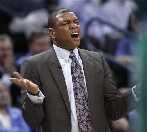 Boston Celtics coach Doc Rivers gestures during the first quarter of an NBA basketball game against the Oklahoma City Thunder in Oklahoma City, Wednesday, Feb. 22, 2012. (AP Photo/Sue Ogrocki)