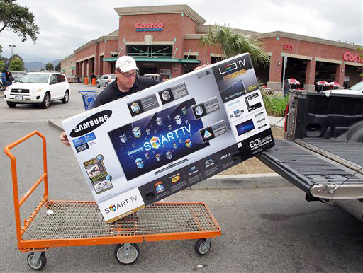 In this Feb. 27, 2012 photo, a shopper from Los Angeles, loads a 60 inch Samsung LED TV into his truck at Costco Wholesale store in Glendale, Calif. A private research group says that consumer confidence in February rose to the highest level since a year ago when the U.S. economy�s outlook started to look brighter before souring again. (AP Photo/Damian Dovarganes)