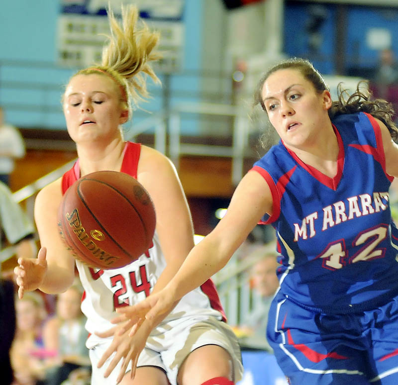RAMS: Cony High School's Emily Sanford, left, is stripped of the ball by Mt. Ararat High School's Mallory Nelson during a basketball match up Wednesday in Augusta.