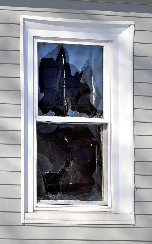 One of three broken windows at Justin DePietro's residence at 29 Violette Ave.